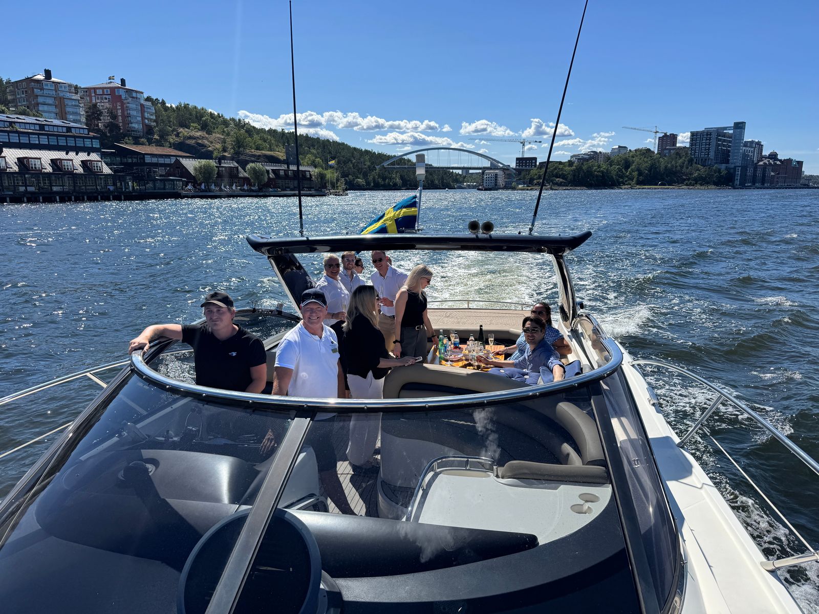 Guests enjoying a private yacht charter on the water in Stockholm, the starting point for trips into the Stockholm archipelago