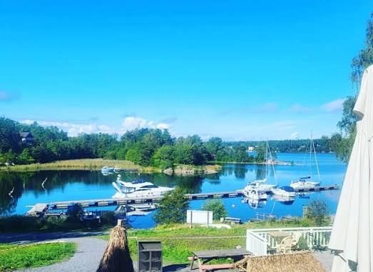 View over a sheltered harbour with moored boats on Blidö in the Stockholm archipelago