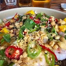 Fresh salad with sliced chilli, peppers, herbs and crushed nuts at Ingmarsö Krog in the Stockholm archipelago