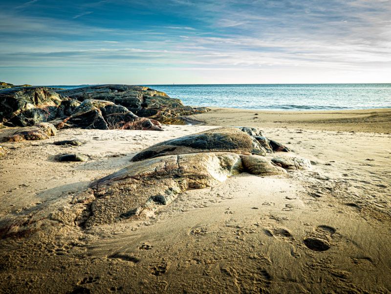 Sandy beach and rounded granite rocks on Sandhamn