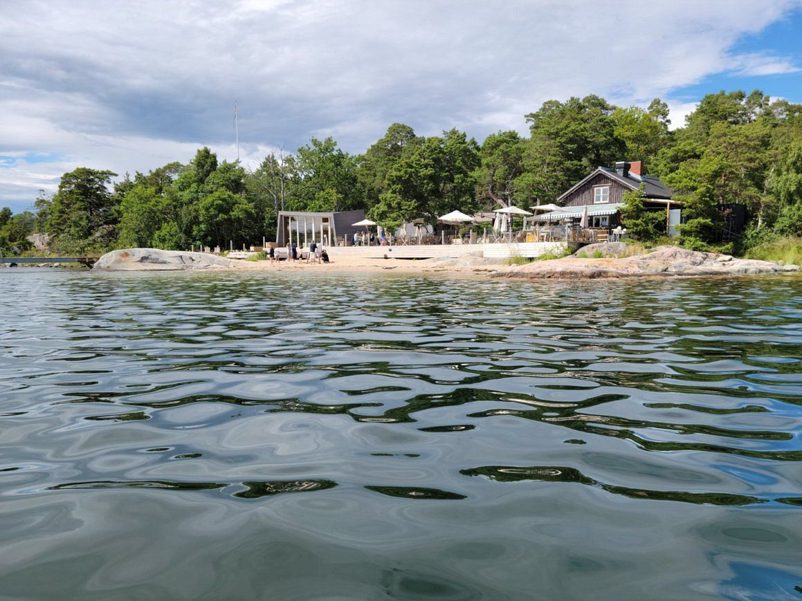 Idöborg's beach and wooden buildings seen from the water