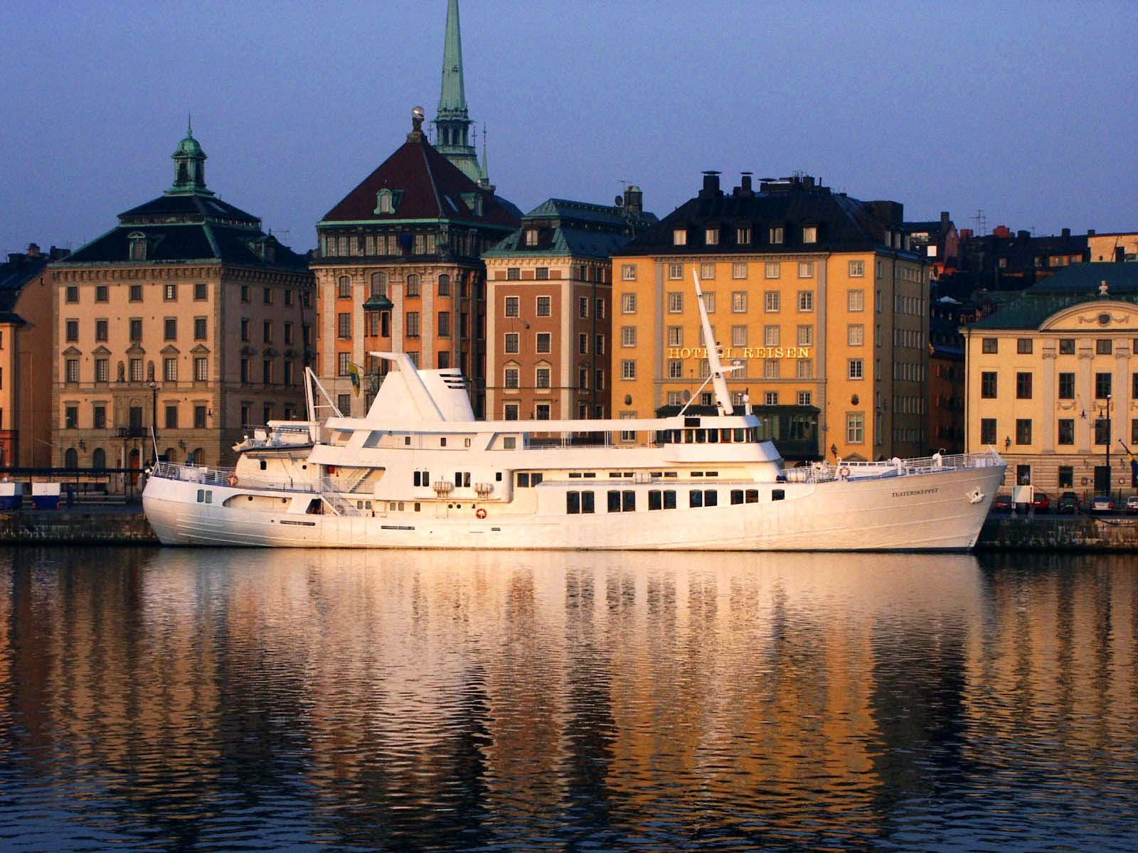 Event ship Teaterskeppet moored at Skeppsbron in Gamla stan, Stockholm, in low golden sunlight